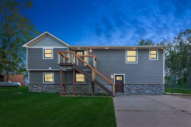 view of front of home with a yard