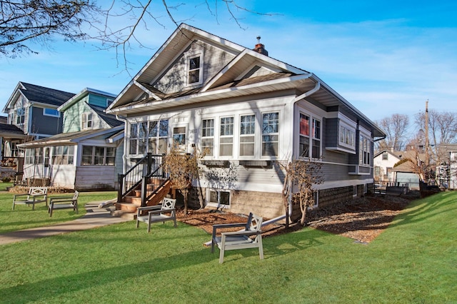 exterior space with a lawn and a sunroom