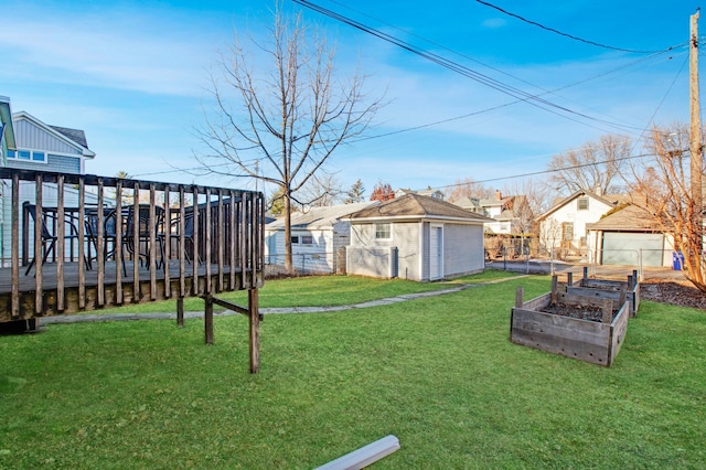 view of yard featuring an outbuilding and a wooden deck