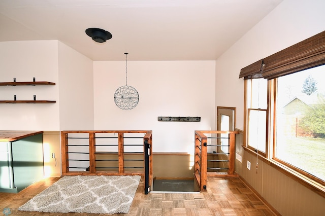 interior space featuring light parquet floors and plenty of natural light