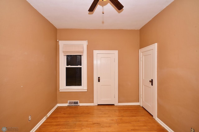 spare room featuring ceiling fan and light hardwood / wood-style flooring