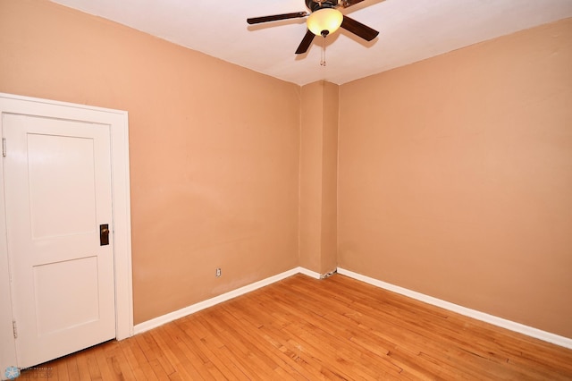 empty room featuring hardwood / wood-style flooring and ceiling fan