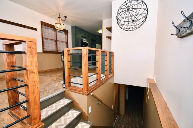 staircase featuring hardwood / wood-style floors