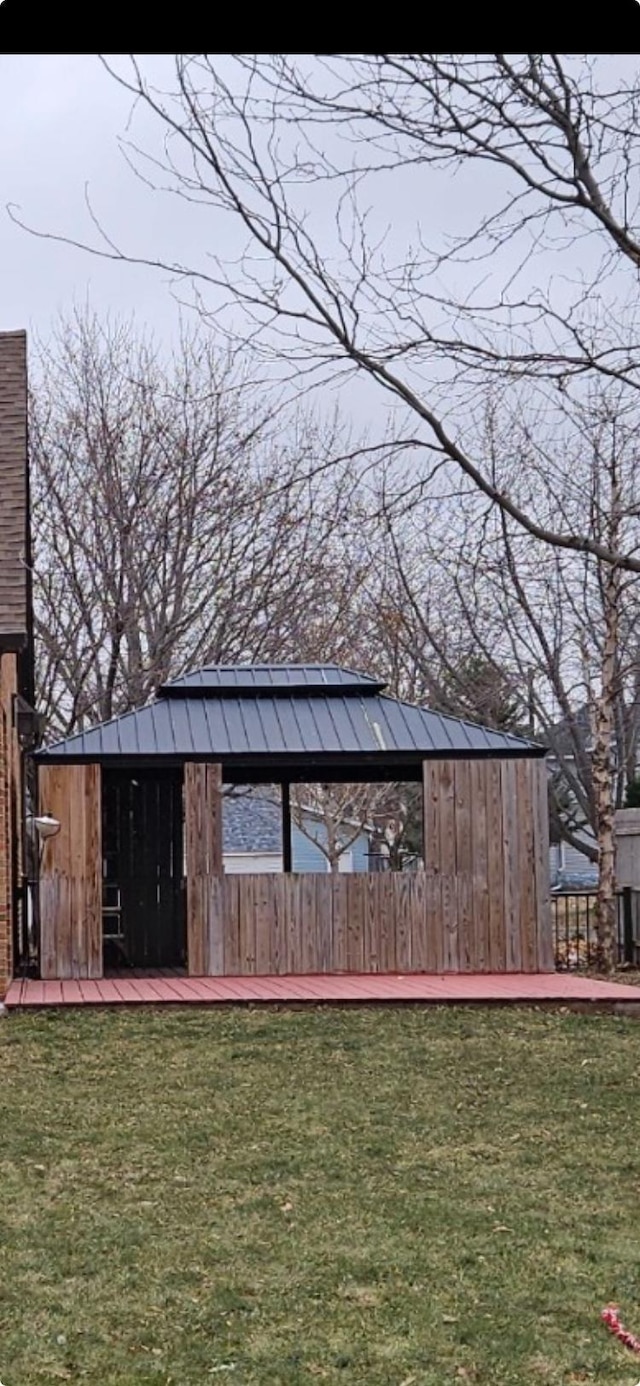 view of outbuilding featuring a lawn