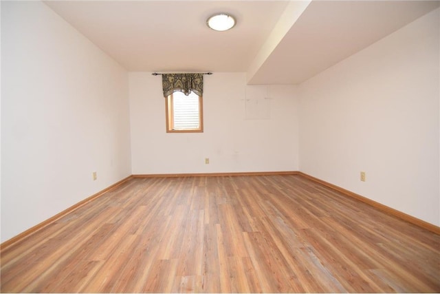 empty room with hardwood / wood-style flooring