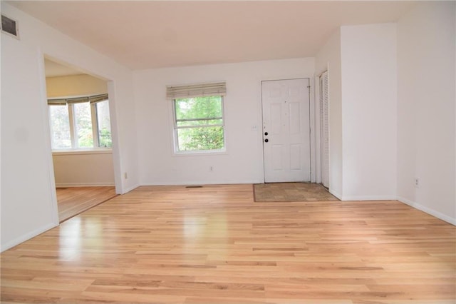 spare room with light hardwood / wood-style floors