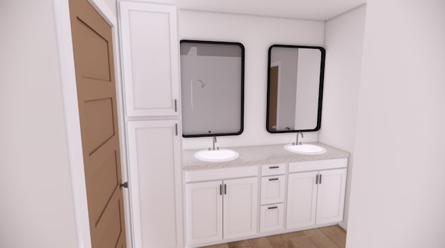 bathroom featuring hardwood / wood-style floors and vanity