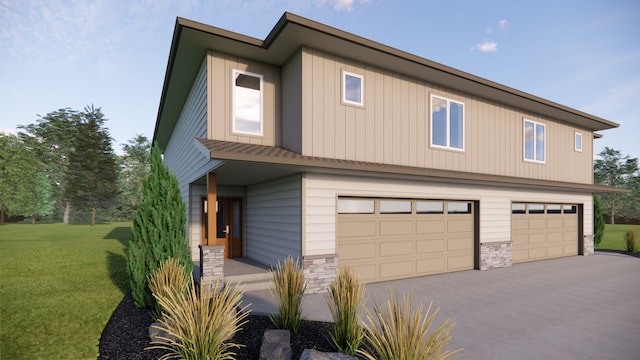 view of front of property with an attached garage, driveway, a front yard, and stone siding