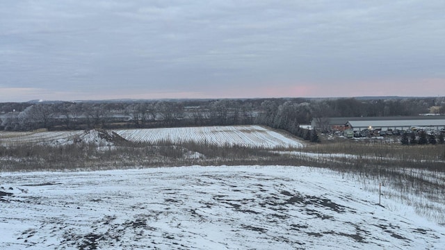 snowy aerial view with a rural view