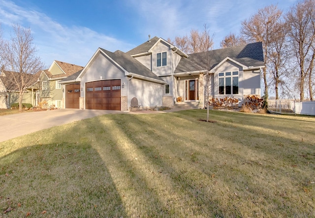 view of front of house featuring a garage and a front lawn