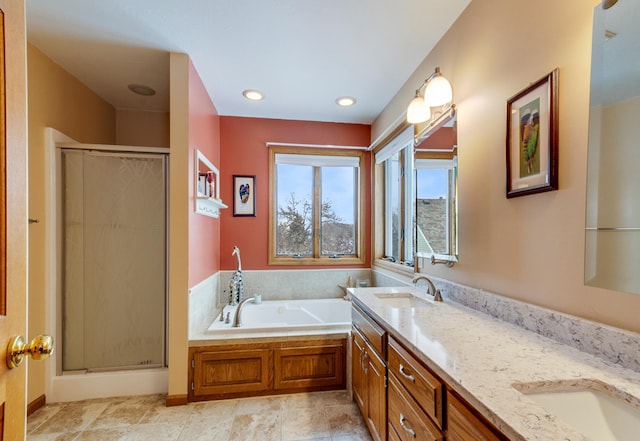 bathroom featuring vanity and separate shower and tub