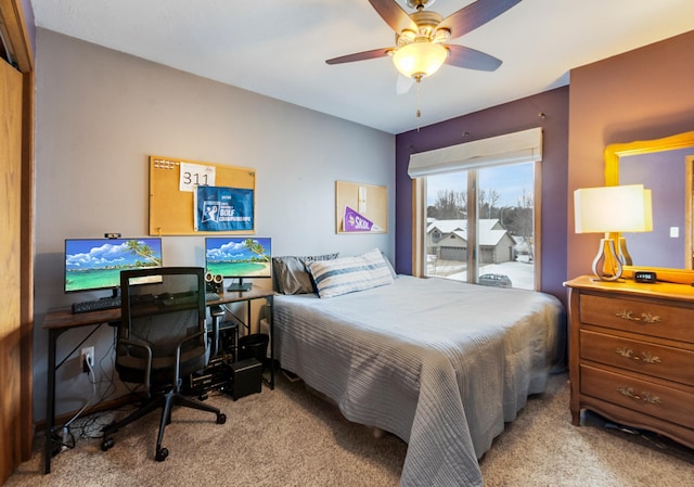 carpeted bedroom featuring access to exterior and ceiling fan