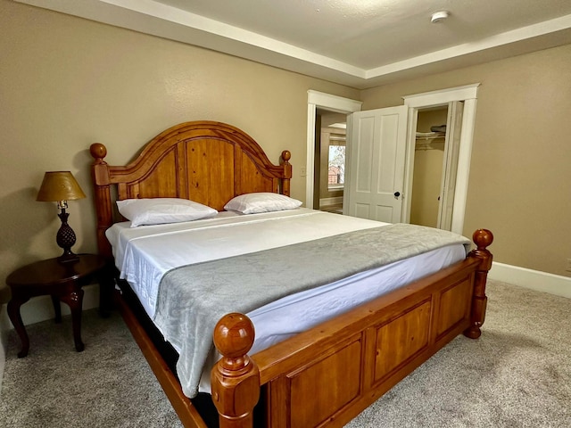 carpeted bedroom with a closet