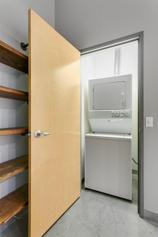 laundry room featuring stacked washer and dryer