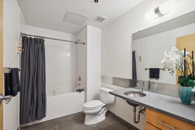 full bathroom featuring toilet, shower / tub combo with curtain, and sink