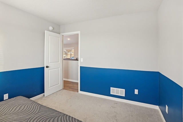 unfurnished bedroom featuring light colored carpet