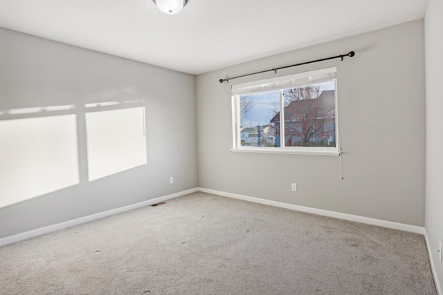 spare room featuring carpet floors