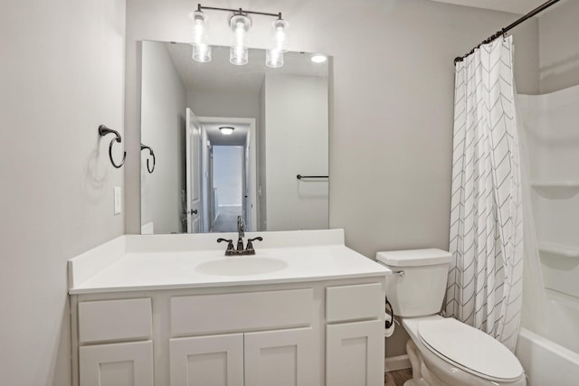 full bathroom with vanity, shower / bathtub combination with curtain, and toilet