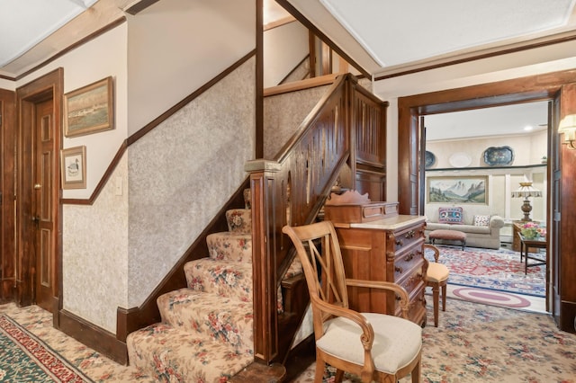 stairs with carpet flooring and crown molding