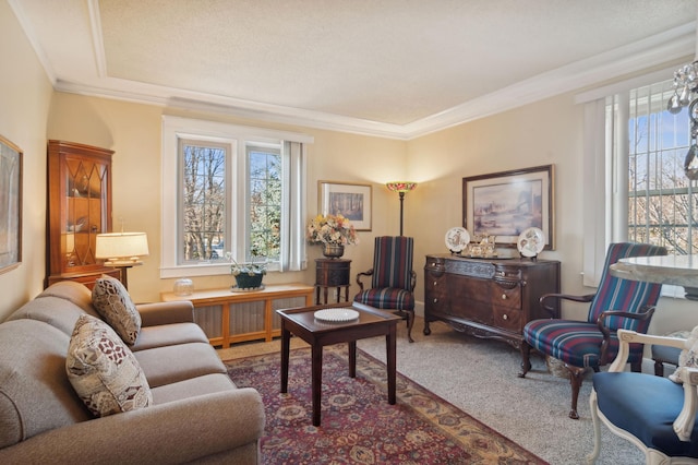 living room featuring carpet, ornamental molding, and a wealth of natural light