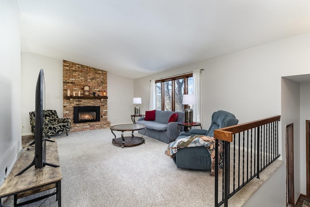 living area with vaulted ceiling, carpet, and a fireplace