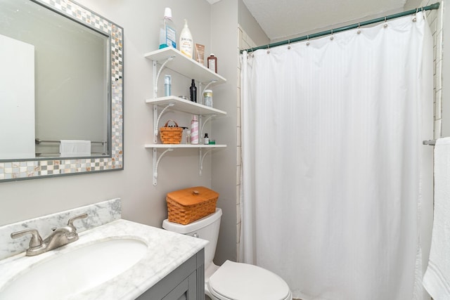 bathroom with vanity, toilet, and a shower with curtain