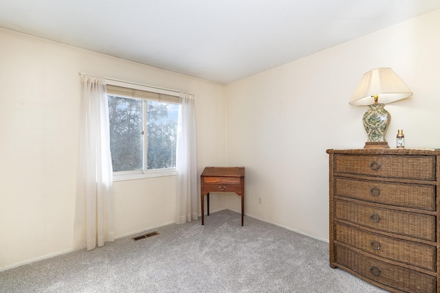 interior space with carpet floors and visible vents