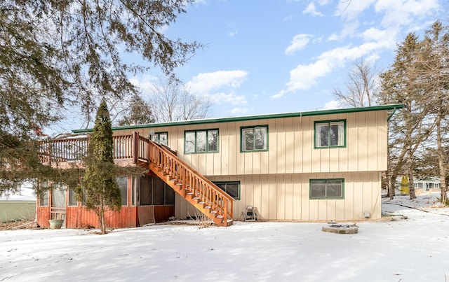 back of house with a deck and stairs