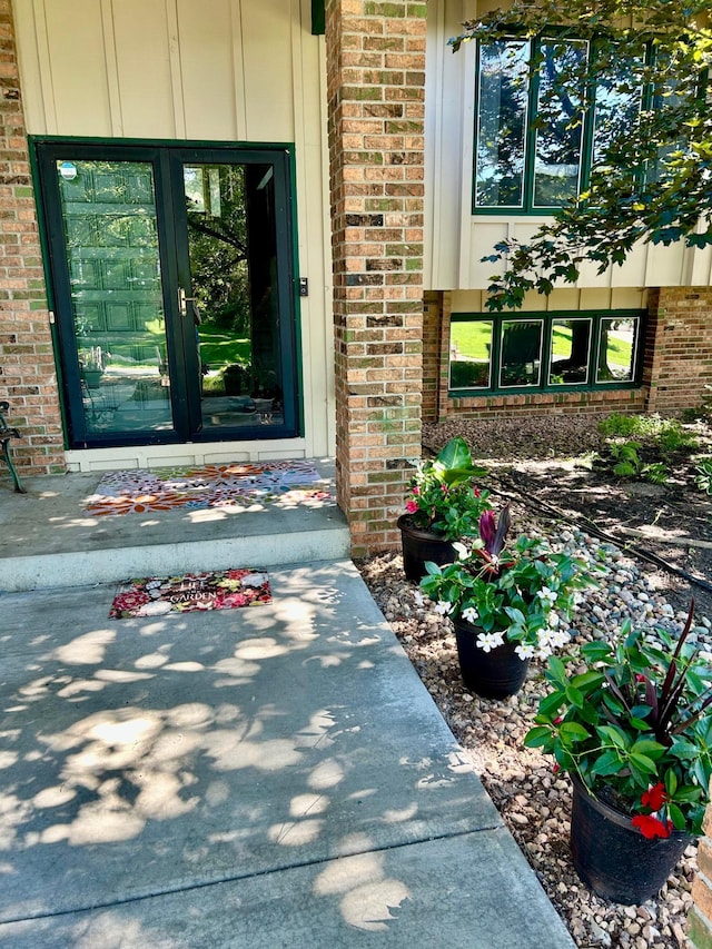 entrance to property with brick siding