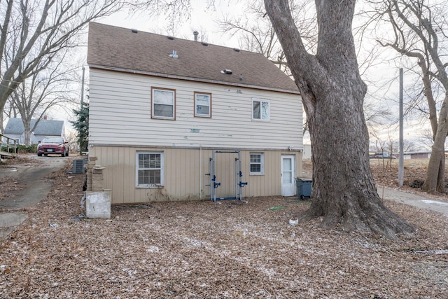 back of property featuring central AC unit