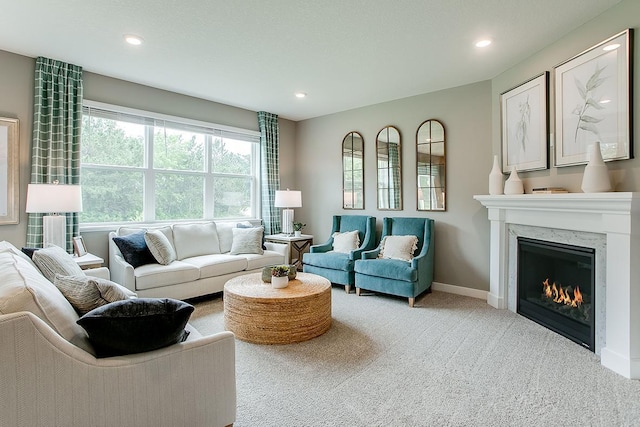 carpeted living room with a fireplace