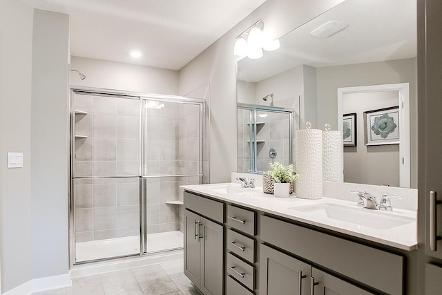 bathroom with vanity and a shower with shower door