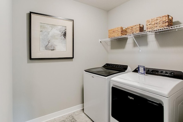 laundry room with washer and dryer