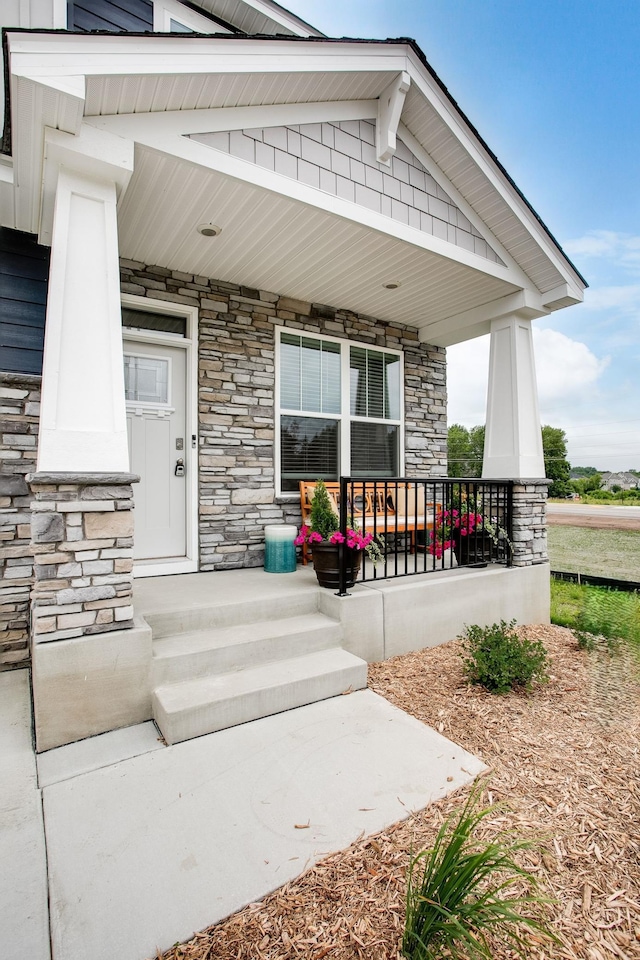 doorway to property featuring covered porch