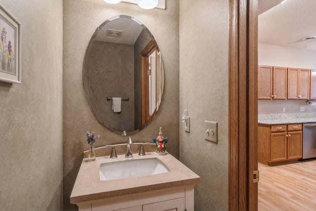 bathroom featuring vanity and hardwood / wood-style flooring