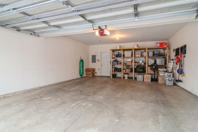 garage featuring a garage door opener and electric panel