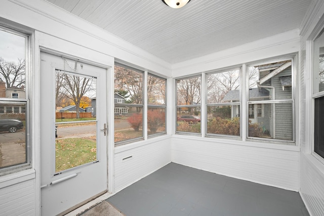 unfurnished sunroom with plenty of natural light