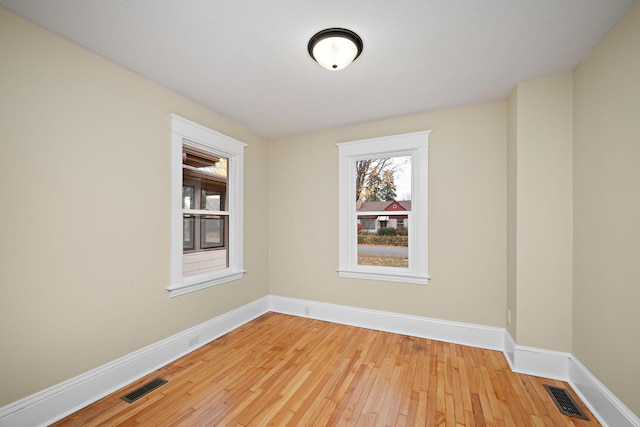 unfurnished room with light hardwood / wood-style floors