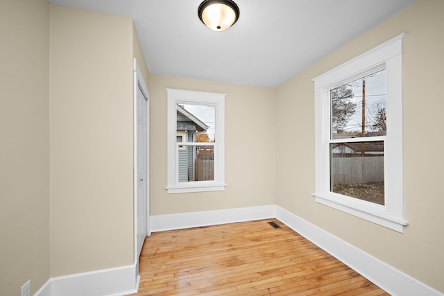 unfurnished room featuring light hardwood / wood-style flooring