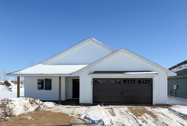 modern inspired farmhouse with a garage