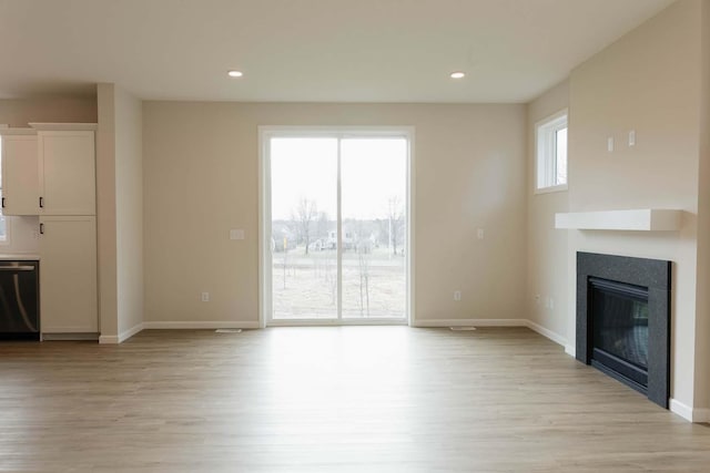 unfurnished living room featuring light hardwood / wood-style flooring