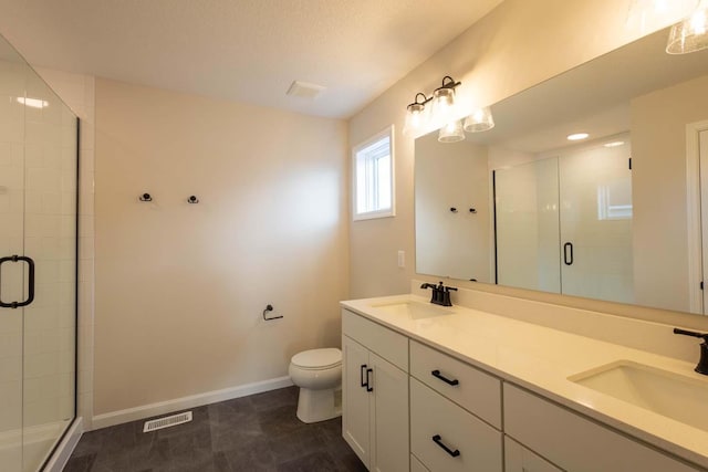 bathroom with vanity, toilet, and walk in shower