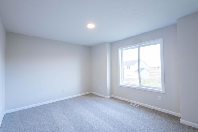 spare room with carpet floors