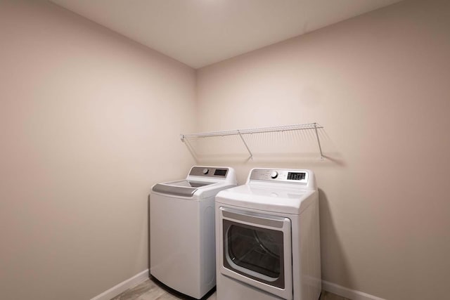 laundry area with separate washer and dryer