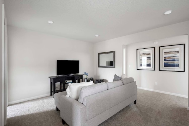 living room with carpet floors, recessed lighting, and baseboards