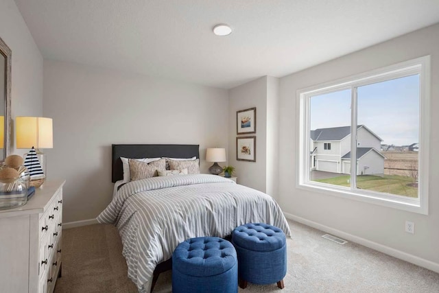 bedroom featuring carpet floors, baseboards, and visible vents