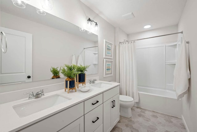bathroom featuring double vanity, a sink, shower / bathtub combination with curtain, and toilet