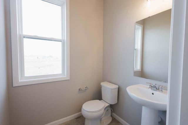 bathroom with toilet and sink