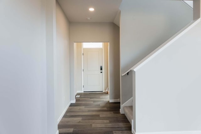 hallway with dark hardwood / wood-style flooring