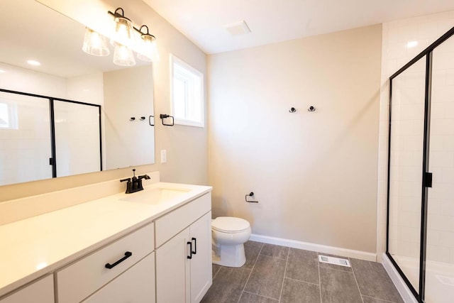 bathroom featuring vanity, an enclosed shower, and toilet